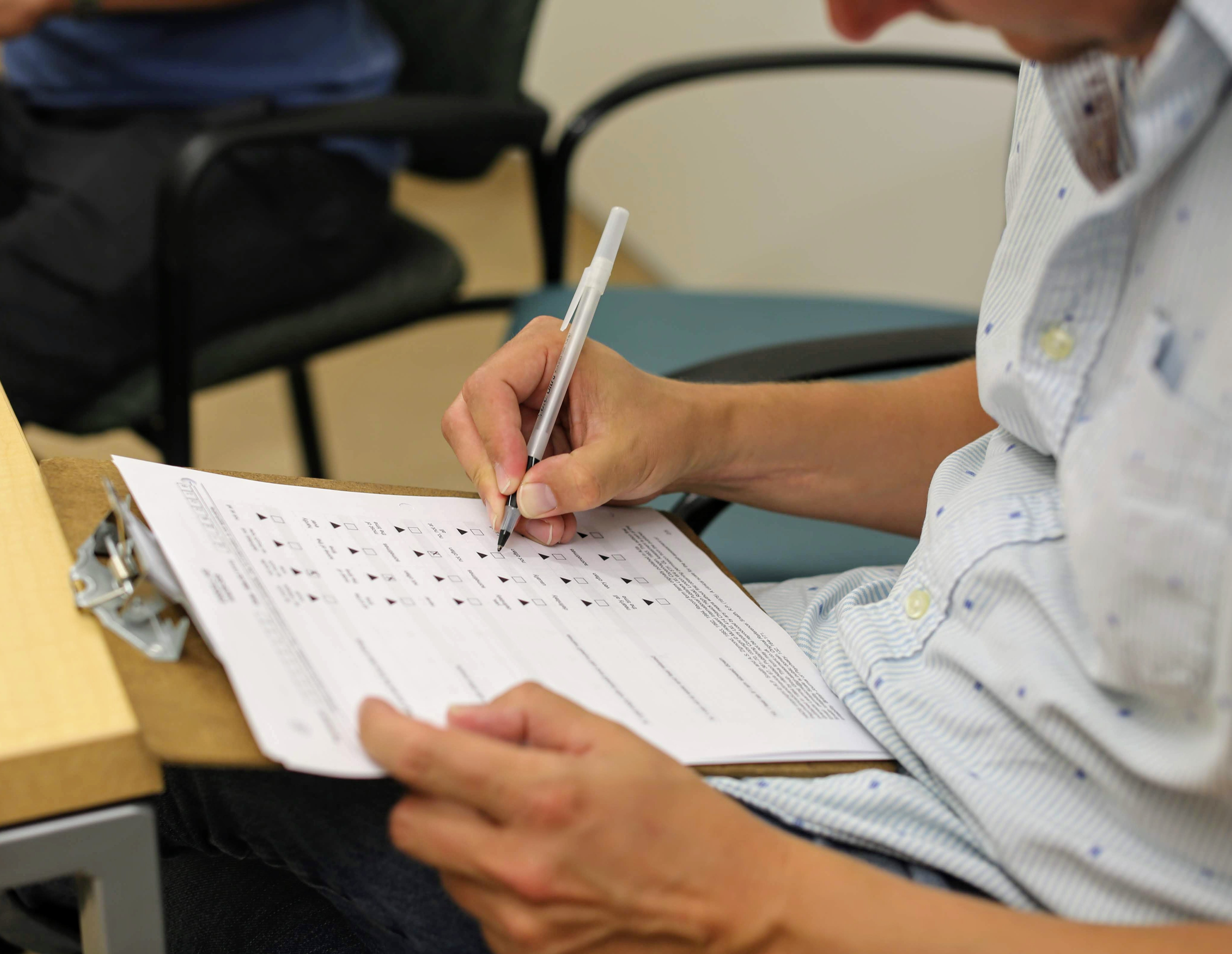 Jeff completes forms that describe his recent mood and health