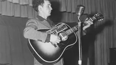 Woody Guthrie, perhaps the most famous person to have had Huntington's disease, was a folk musician with a guitar emblazoned with “This machine kills fascists”. Reminiscent of Gutrhie’s guitar, Ed said, “HDBuzz was always a machine for turning hope into action”.  