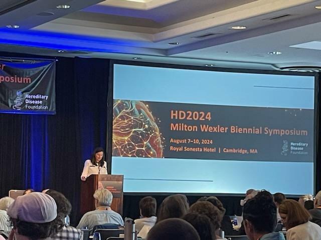 Meghan Donaldson, CEO of the HDF, opened day 2 of the conference with welcoming remarks highlighting the tenacity and perseverance of HD researchers, traits frequently seen in people living with HD, like her brother Christopher who recently passed from late stage HD.  